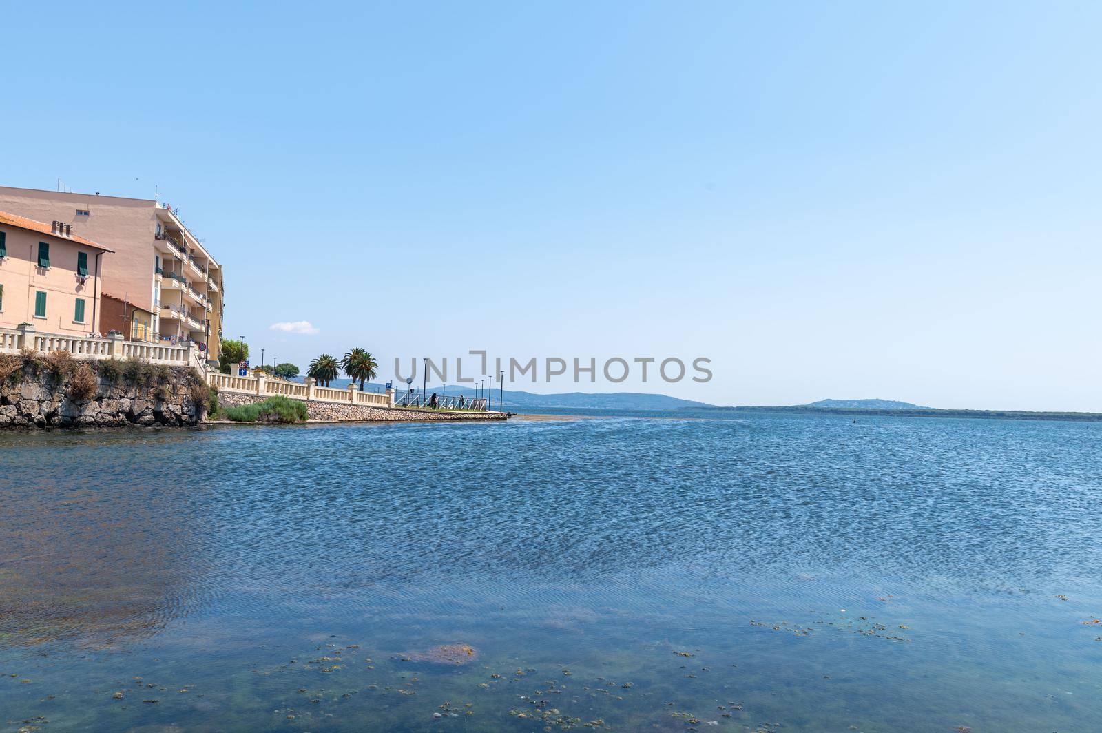 landscape of the town of orbetello and the sea in summer