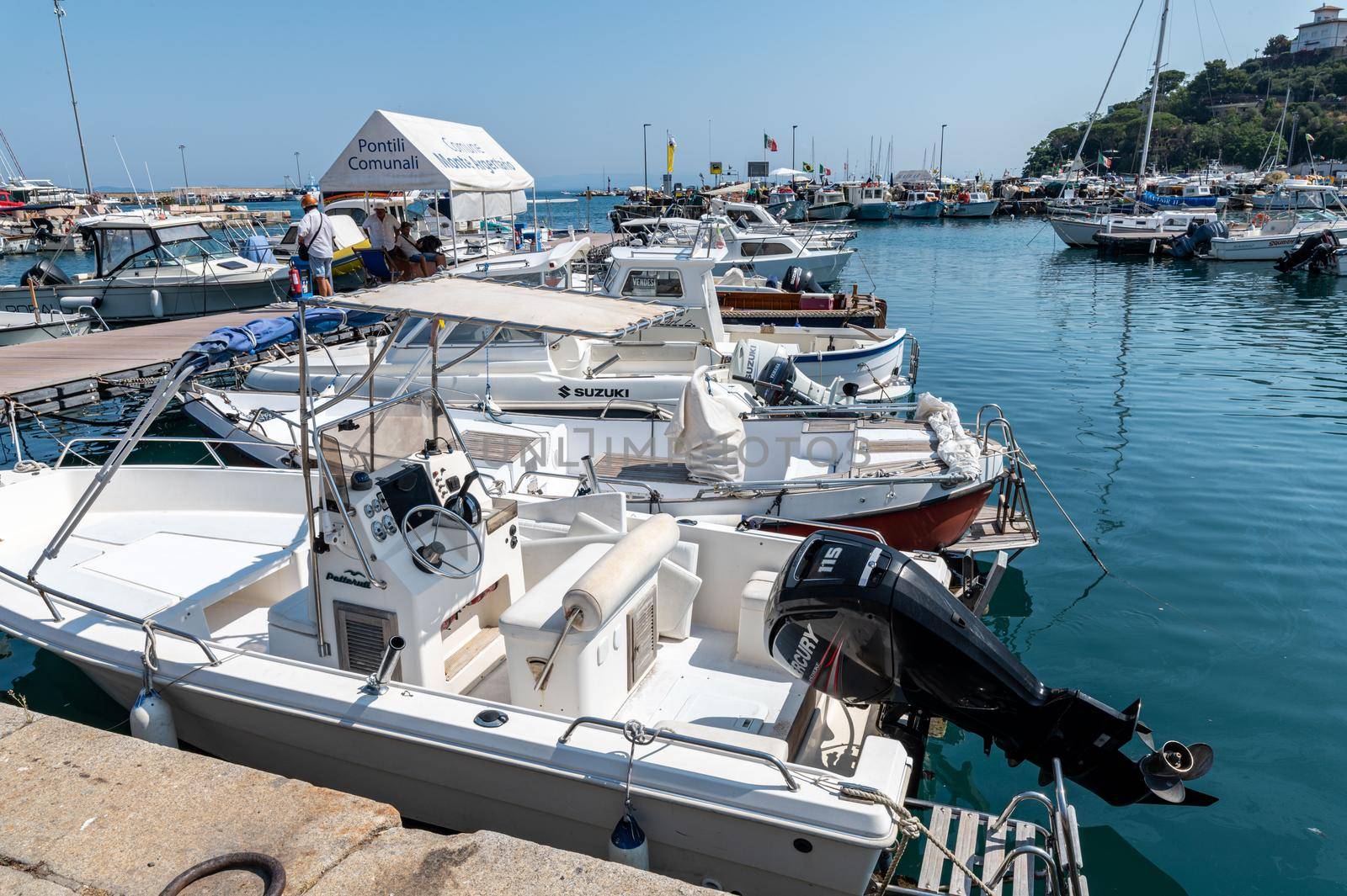 motorboats on the pier of porto santo stefano by carfedeph