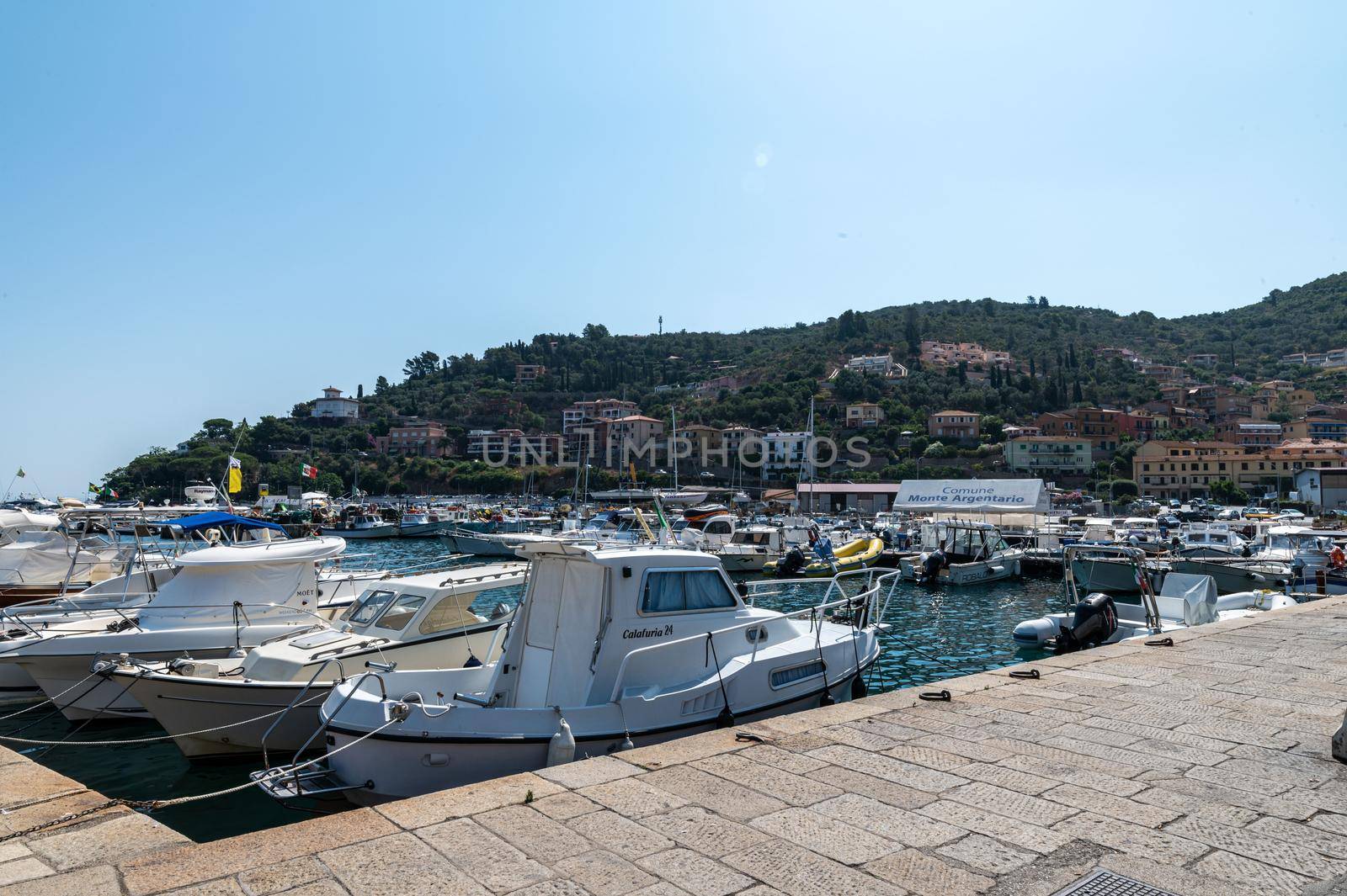 motorboats on the pier of porto santo stefano by carfedeph