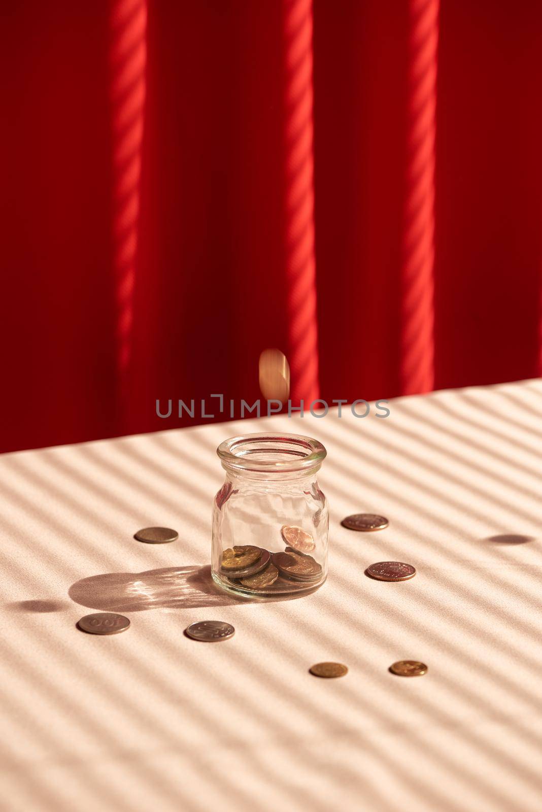 Coins in glass jar. Money savings concept by makidotvn