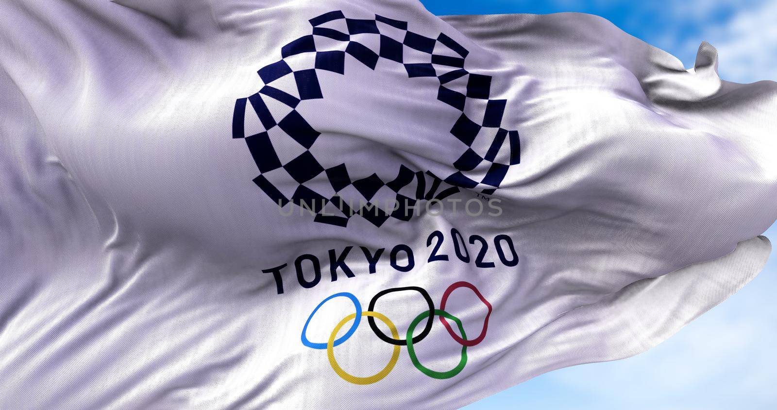 Tokyo, Japan, July 2021: Tokyo 2020 olympic flag waving in the wind by rarrarorro