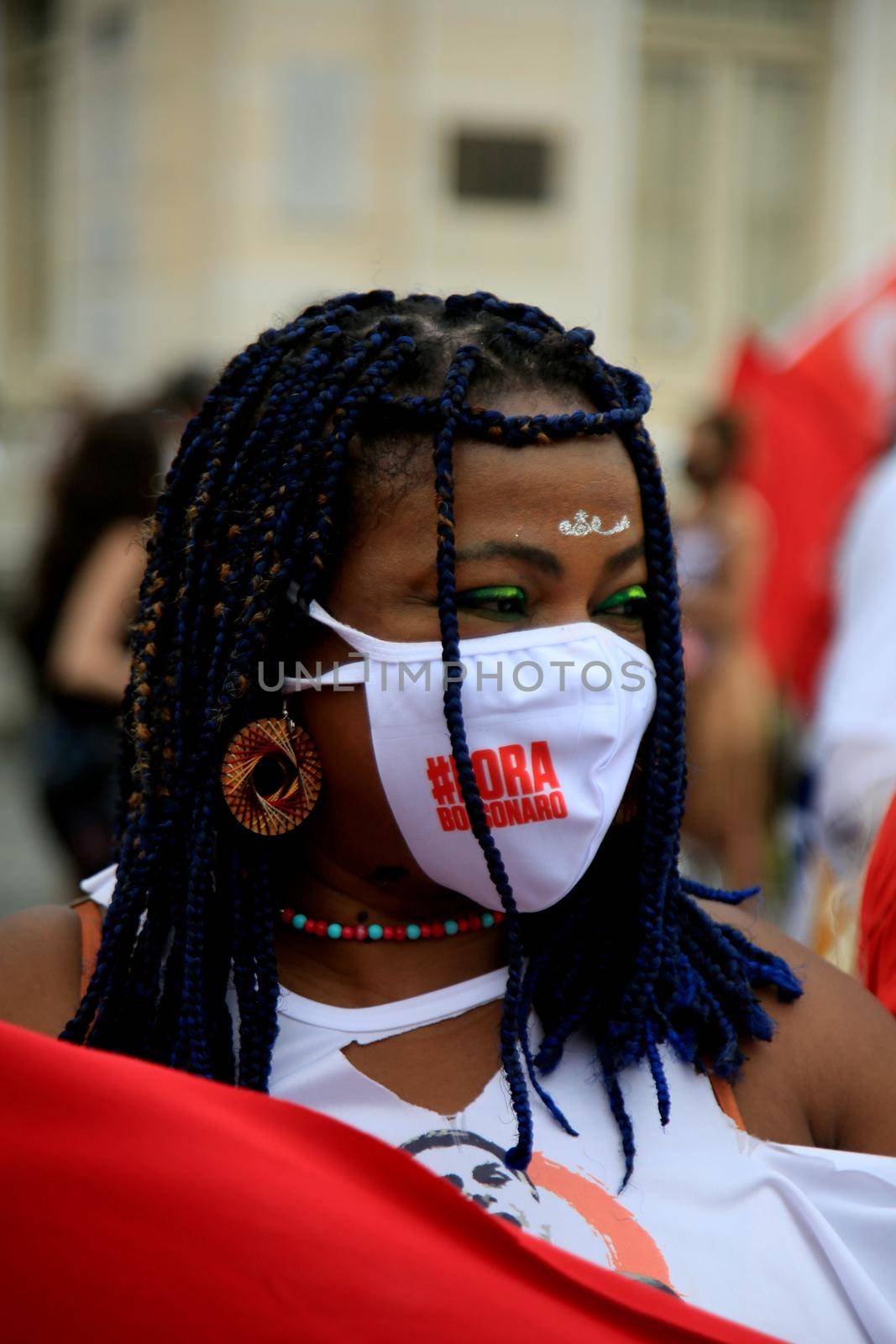 salvador, bahia, brazil - july 24, 2018: Black woman wearing mask during protest against President Jair Bolsonaro's government in the city of Salvador.