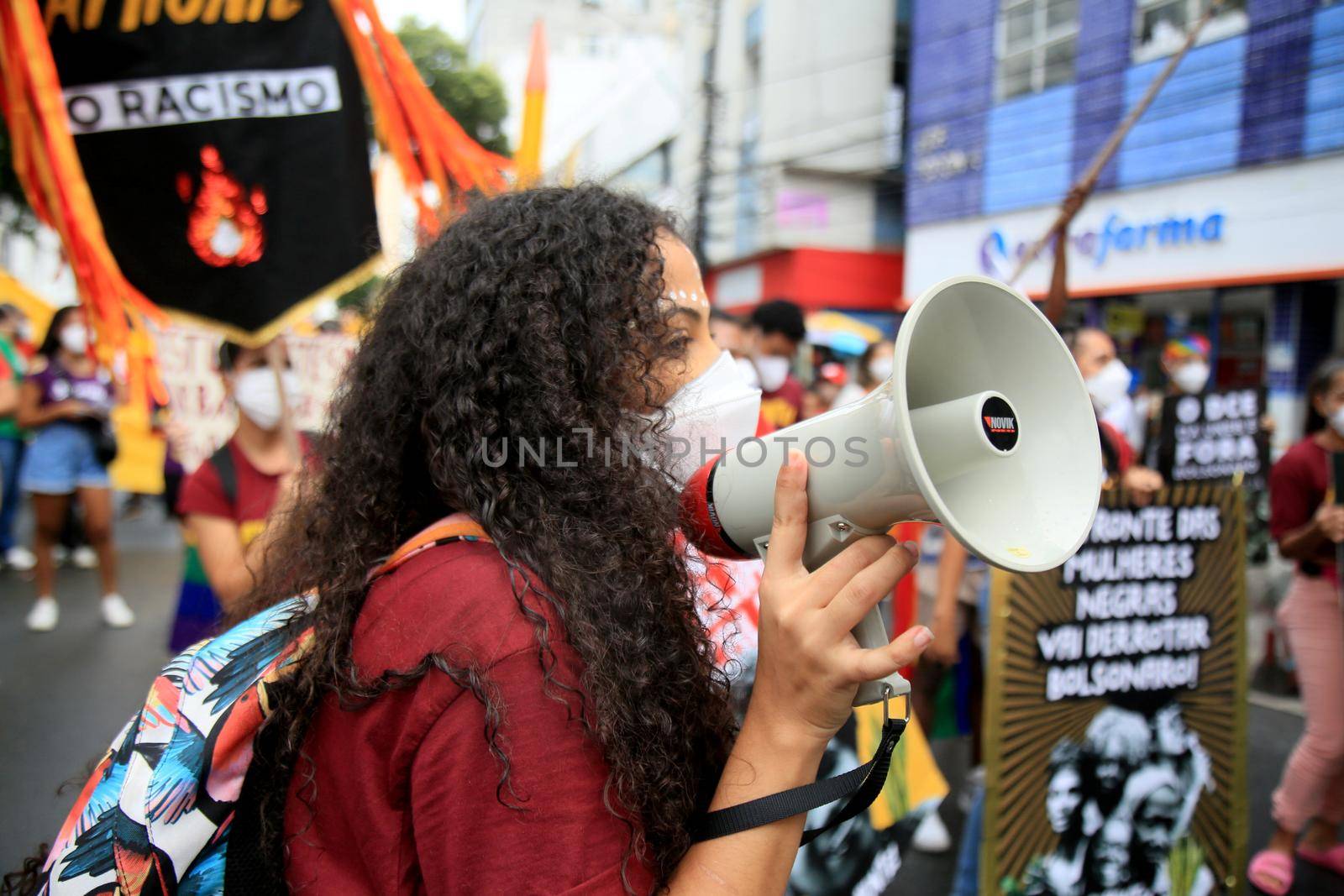 salvador, bahia, brazil - july 24, 2018: Protester uses Brazil megaphone during protest against President Jair Bolsonaro's government in Salvador city.