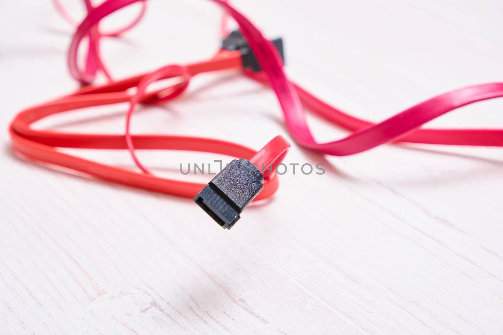 red computer wires for hard drive on light background