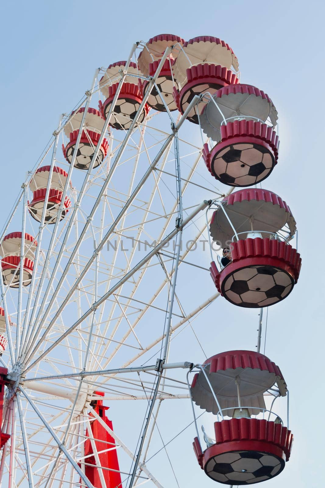 Ferris wheel on blue sky background