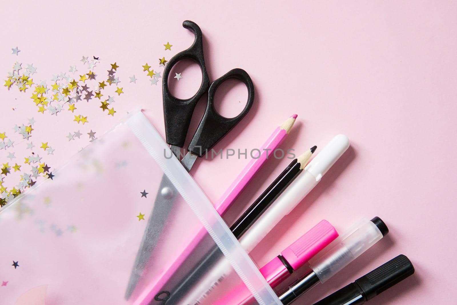 School supplies. Black, white and pink colors. Flat lay composition. Pink background. Back to school.