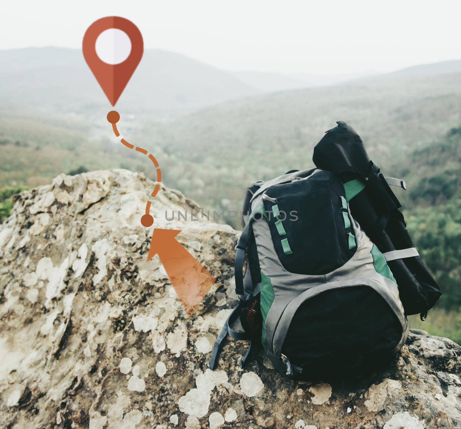 Backpack on peak of rocky mountain with scheme of track and connected location pins. Navigation concept. No people.