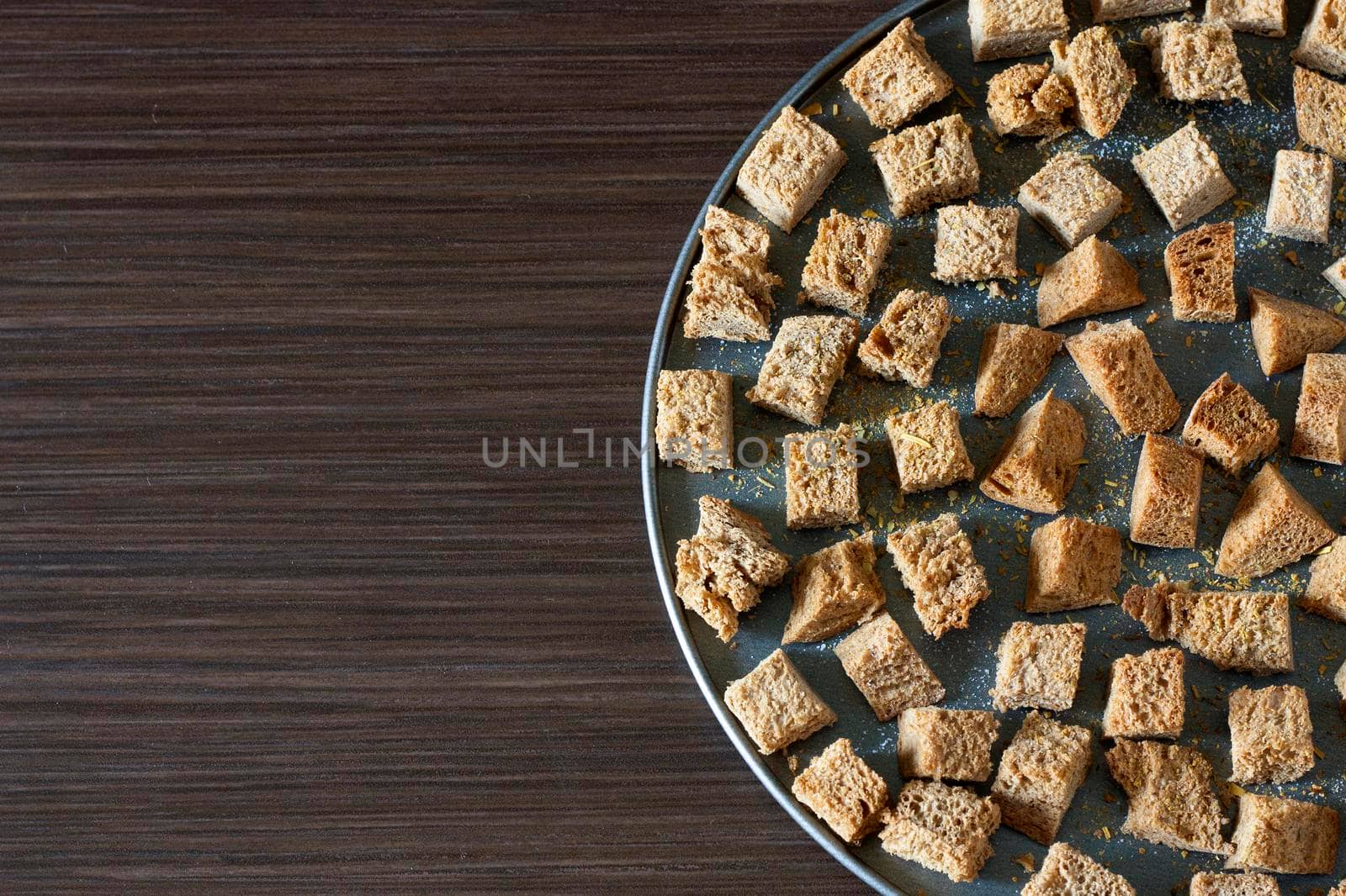 Crackers on a baking sheet on a dark background