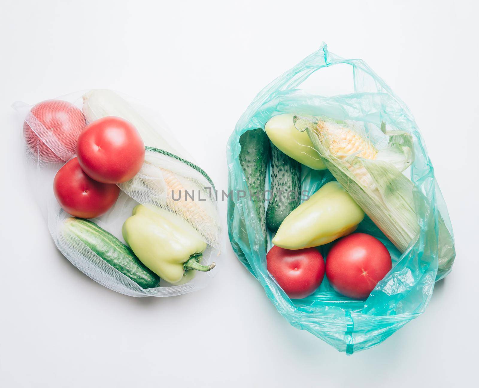 Ecological choice: vegetables in reusable bag or plastic package. Zero waste concept.