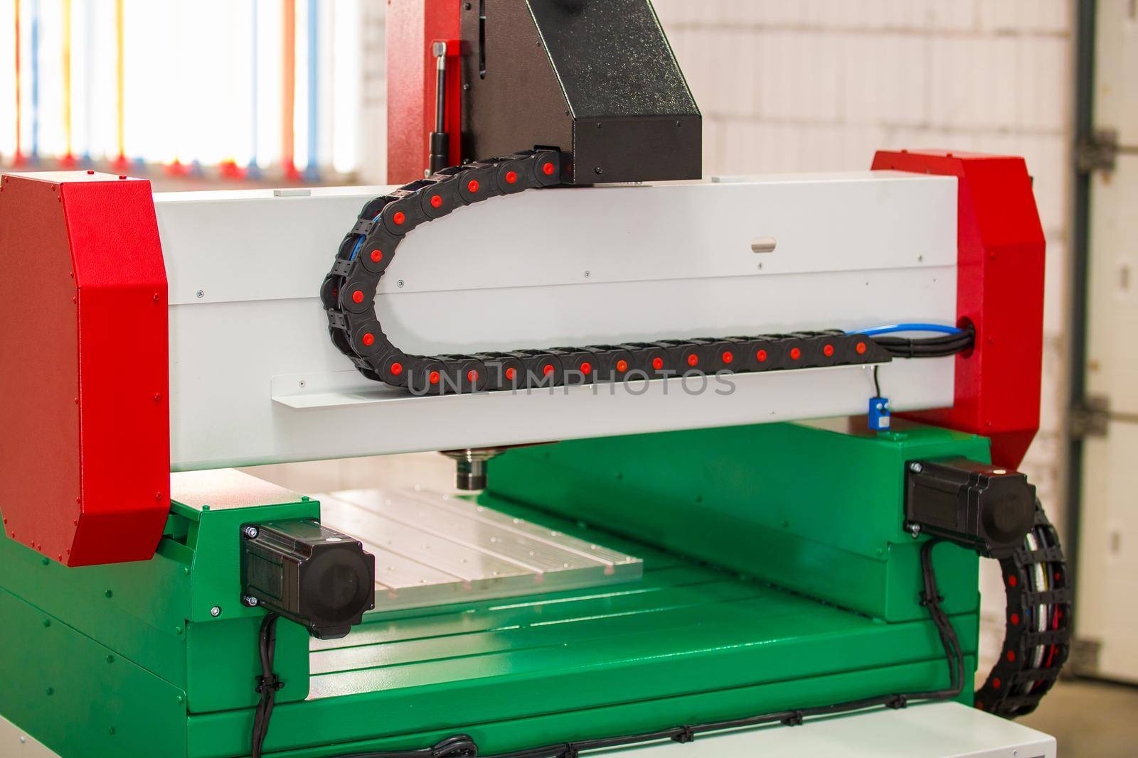 Dynamic part of automated CNC equipment for working with metal. The programmed robot head. Telephoto shot