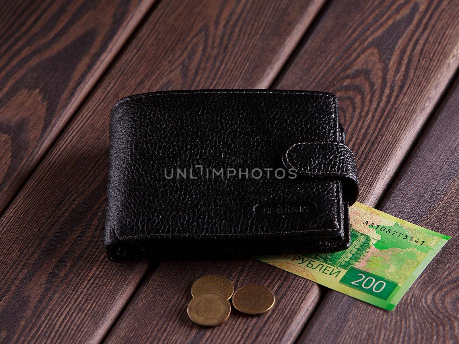 Wallet and money on wood background by denisv86