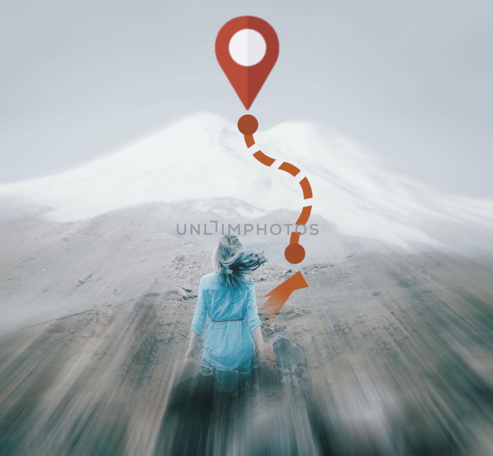 Rear view of dreaming young woman in front of mount Elbrus outdoor and GPS route to peak. Navigation concept. Image with moving fast and motion blur effect.