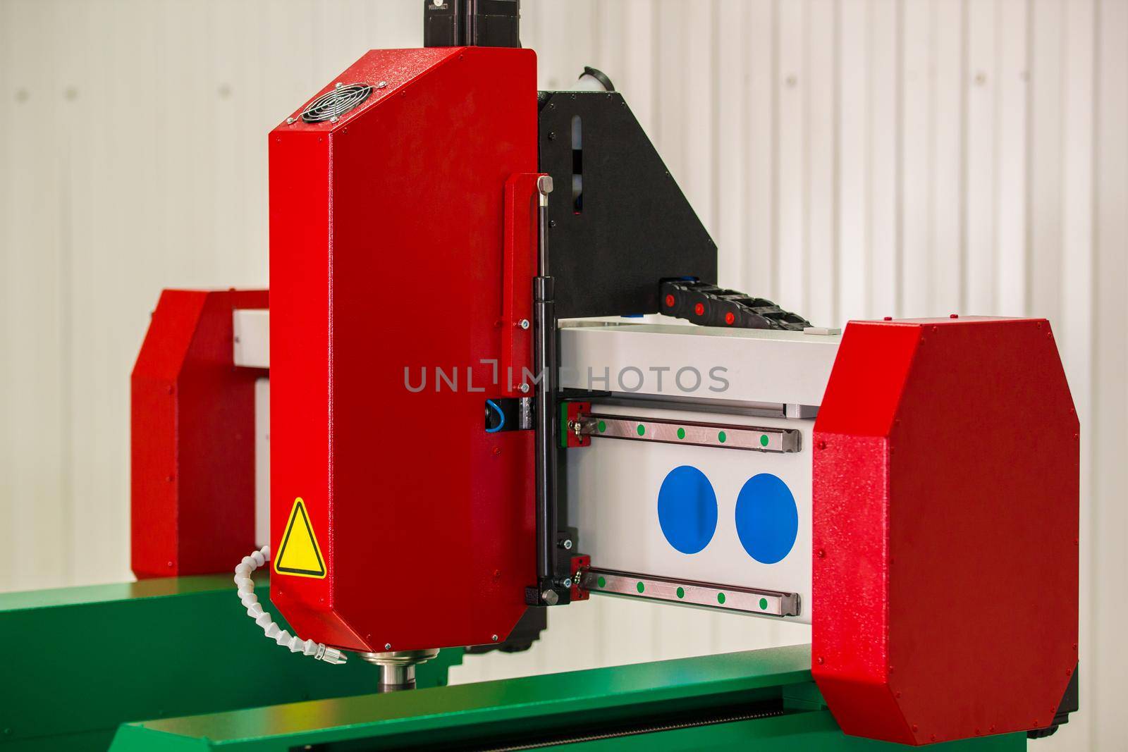 Part of automated CNC equipment for working with metal. The programmed robot head. Telephoto shot