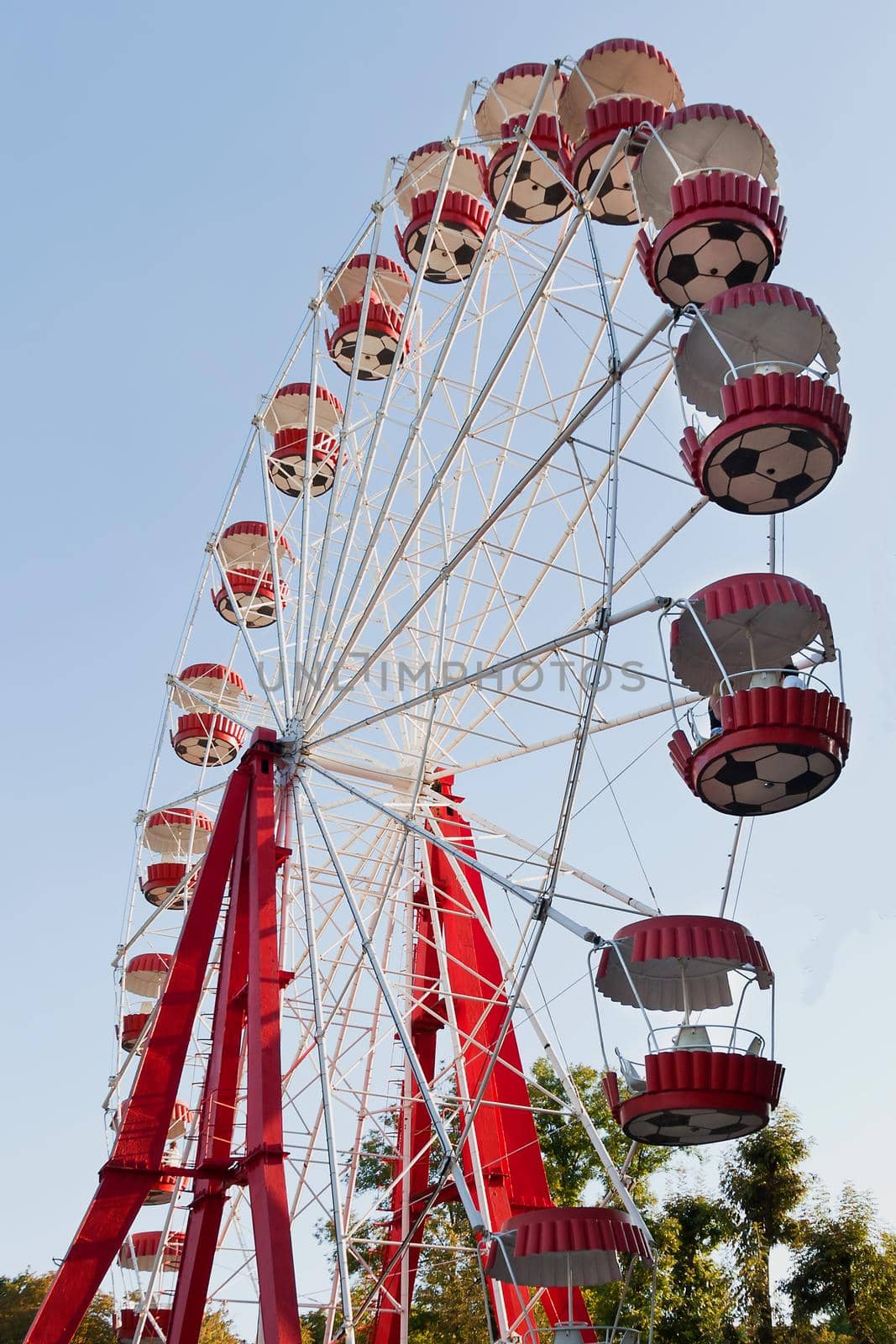 Ferris wheel on blue sky background by marketlan