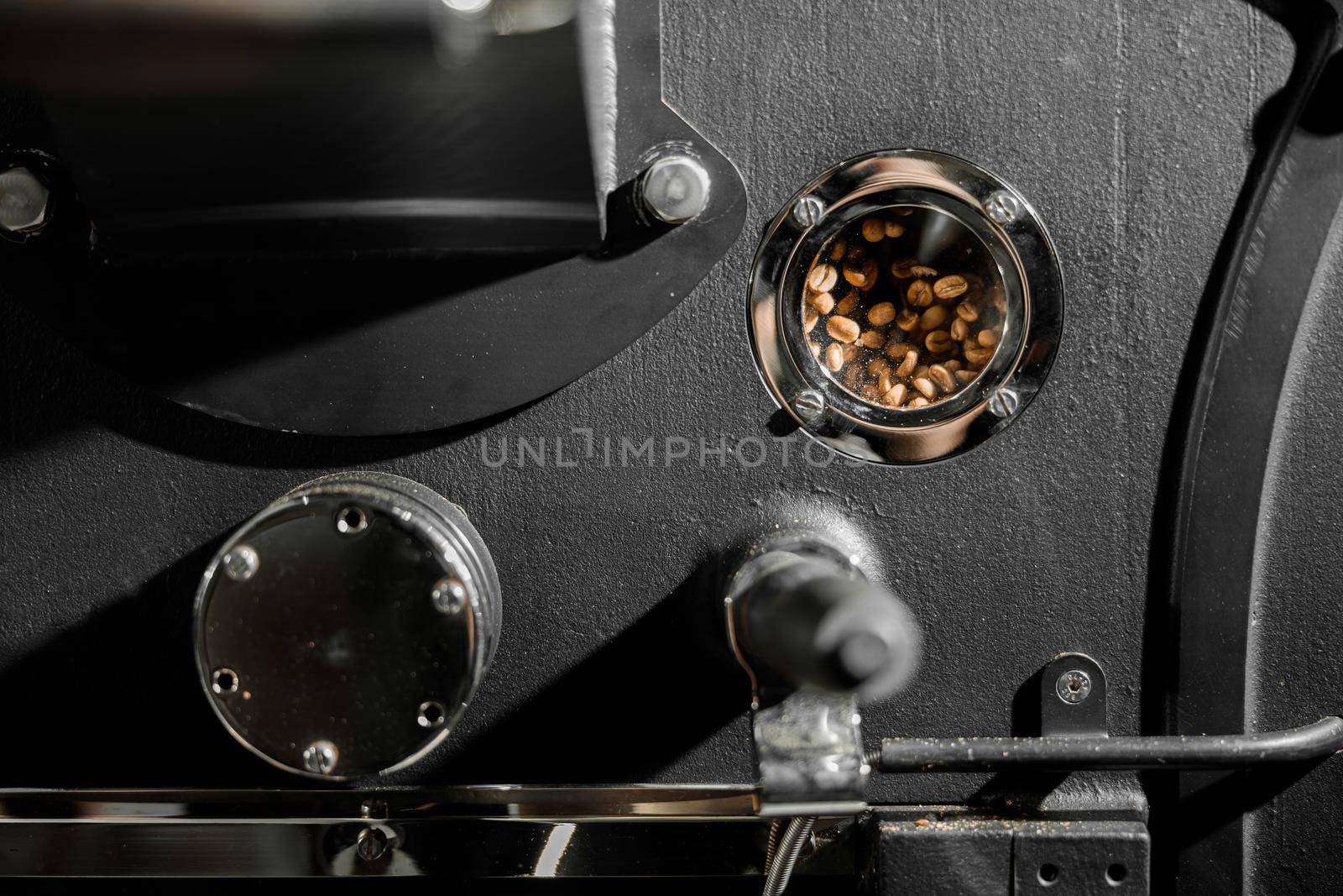 Coffee processing. Roastery, roasting machine and fresh beans