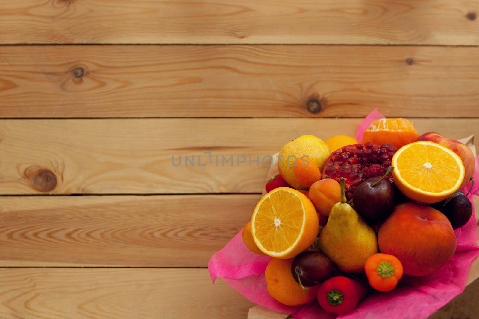 fruit fresh bouquet on wooden table flat lay- thanksgiving day, healthy eco food, selective focus. Autumn harvest concept, old wooden table with oranges, plums, peppers, pear and peaches