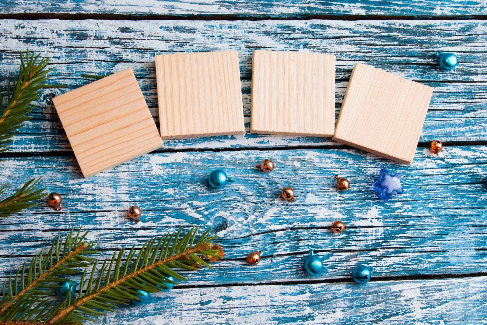 wooden cubes for your new year dates top view new year concept blue wooden background fir branch