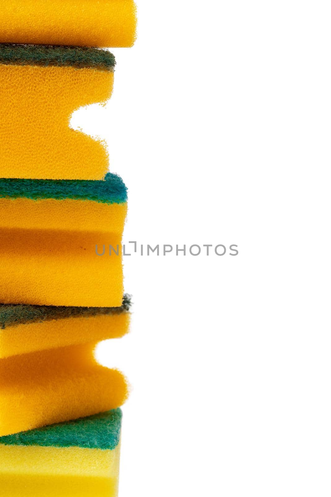 Stack of kitchen sponges isolated on white background, close up