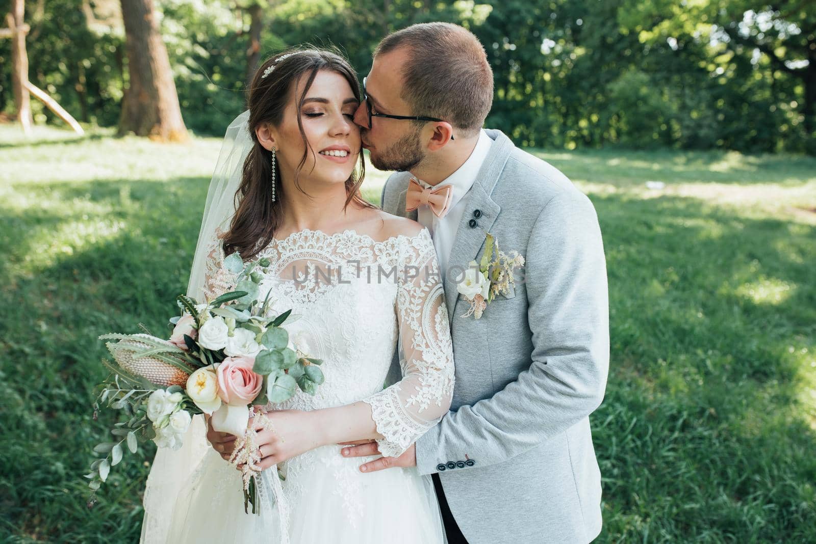 Wedding photography kiss bride and groom in different locations.