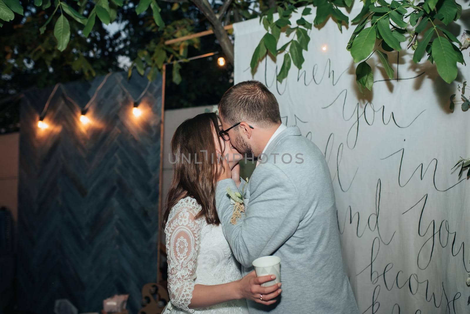 Wedding photography kiss bride and groom in different locations.