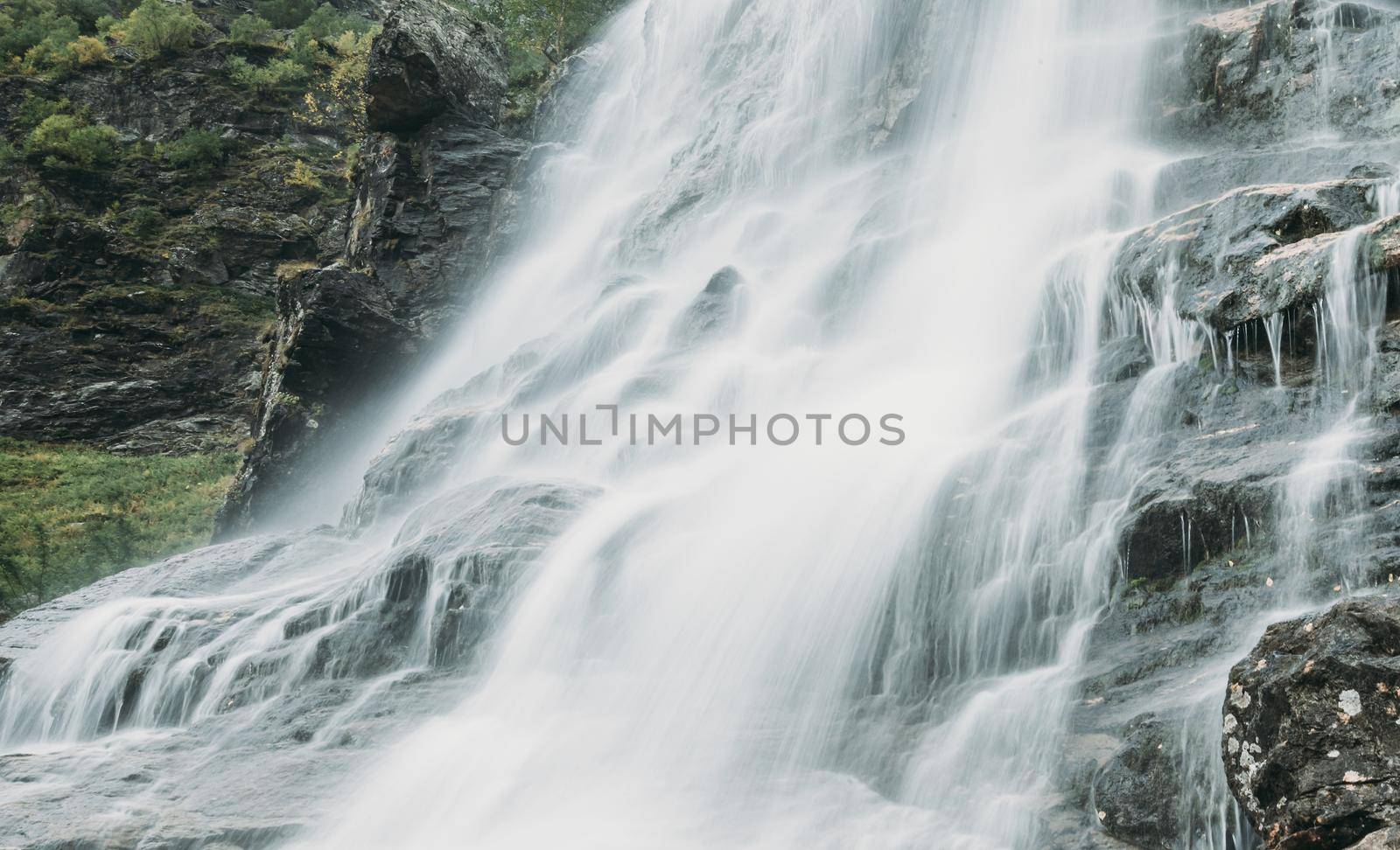 Beautiful waterfall in summer, close-up