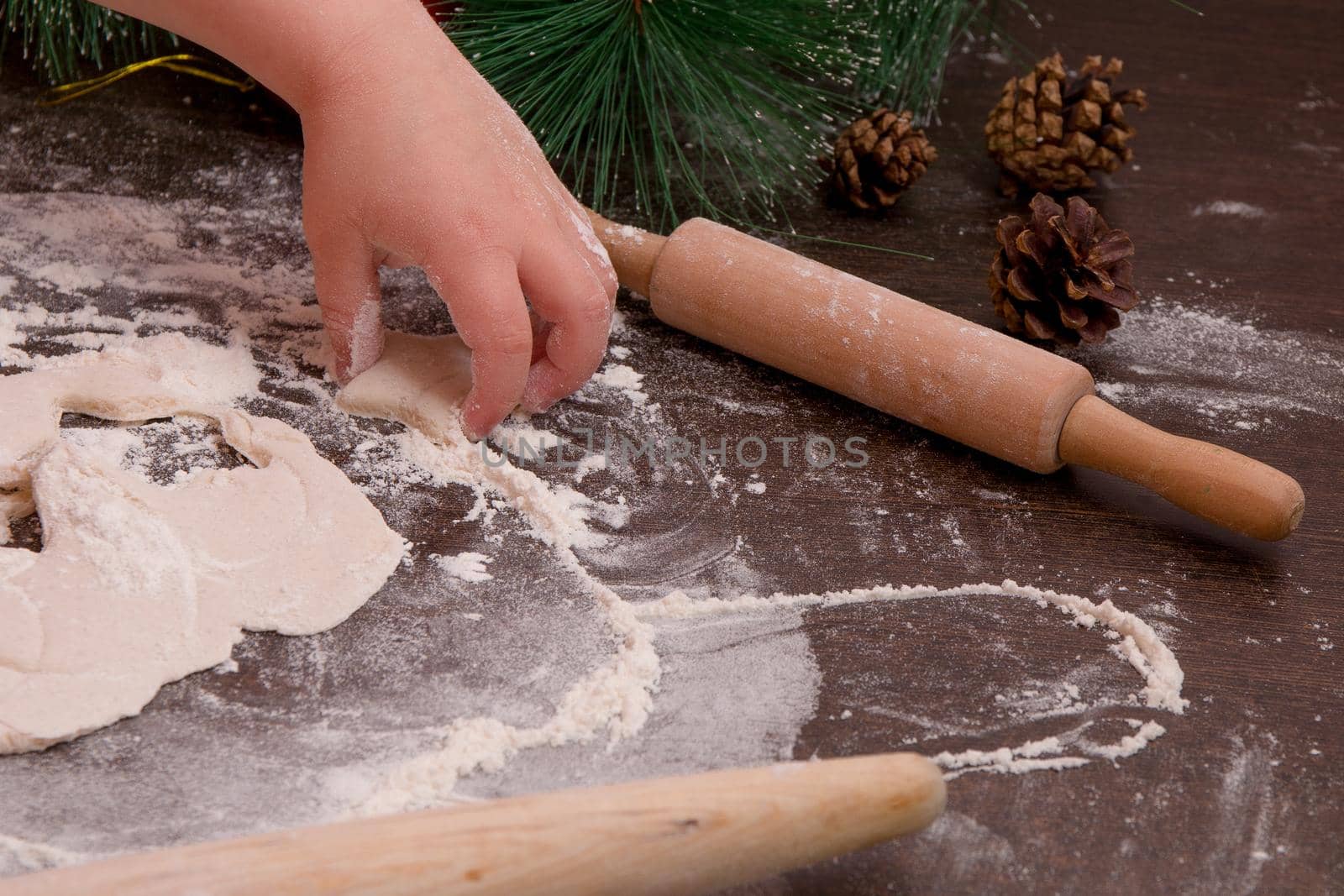 children's hand sculpt cookies, new year, christmas background, copy place, cookie in the shape of a star, dark wooden table