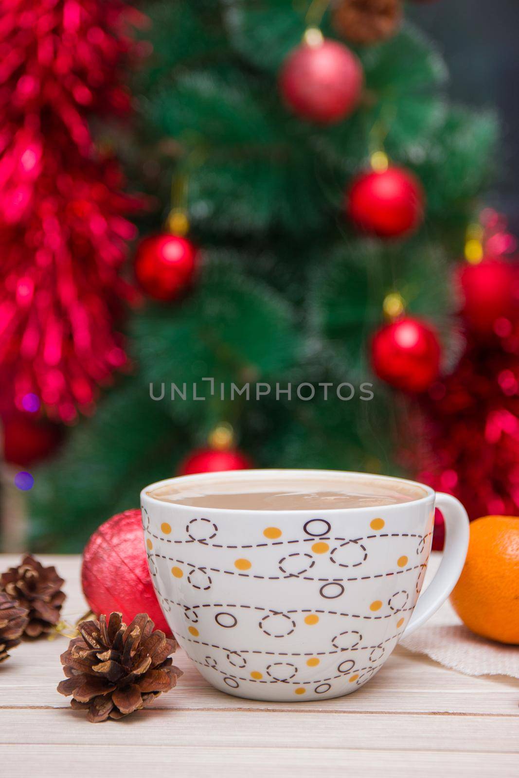 cup of coffee on the background of a festive Christmas tree by natashko