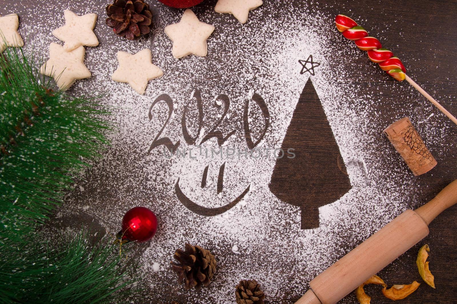 new year, christmas, 2020, flour on the table, christmas tree silhouette, star-shaped cookies, christmas decor, christmas cooking, top view, copy place, smile