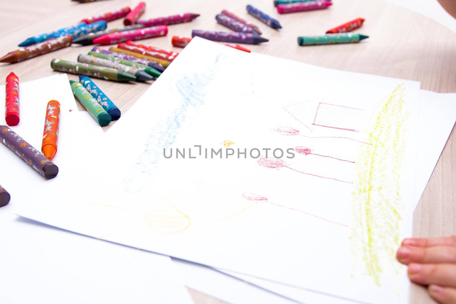 child's drawing on white paper landscape concept of home and family