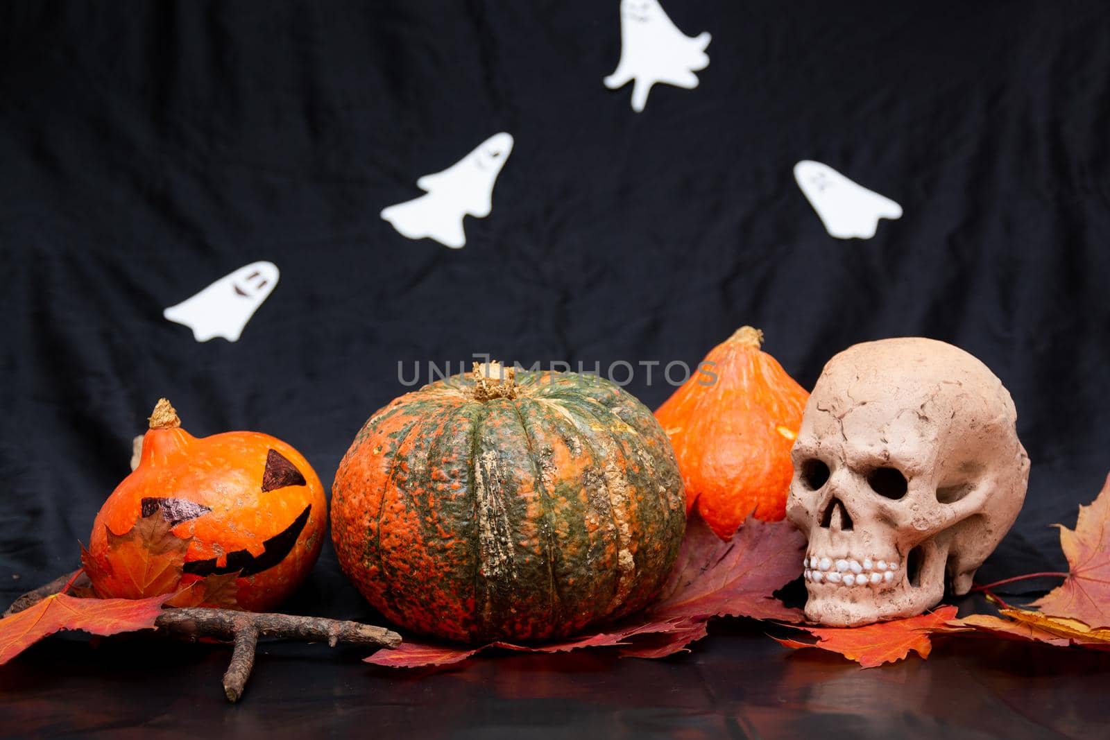 skull, halloween pumpkins, jack's head and autumn leaves on a black background, preparation for the baby cherry, still life, celebrate October 31 by natashko