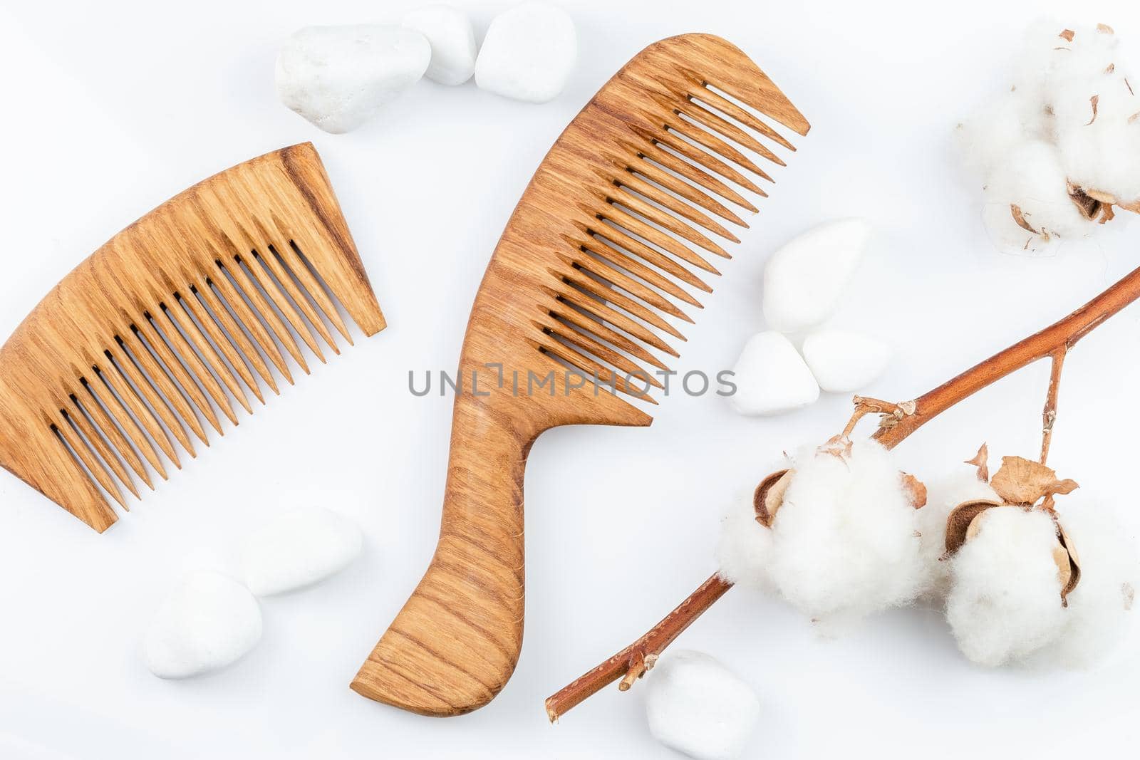 Wooden hair combs on a white background. Personal care, zero waste, sustainable lifestyle