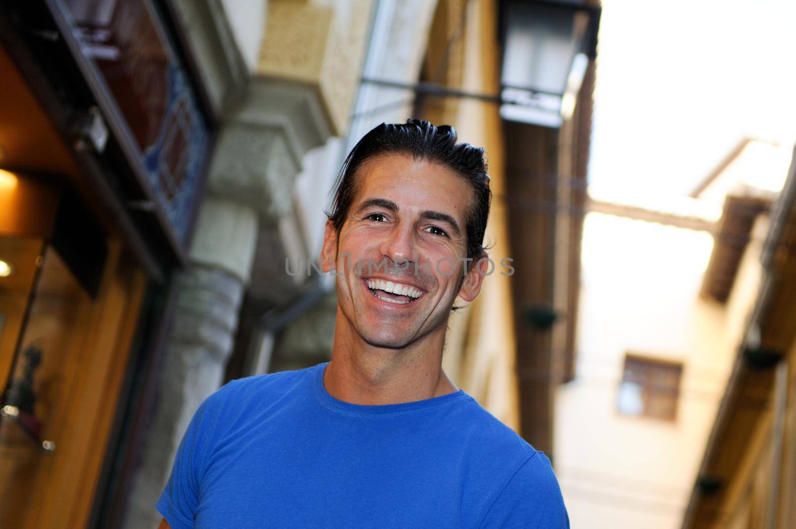 Portrait of an attractive smiling man in urban background