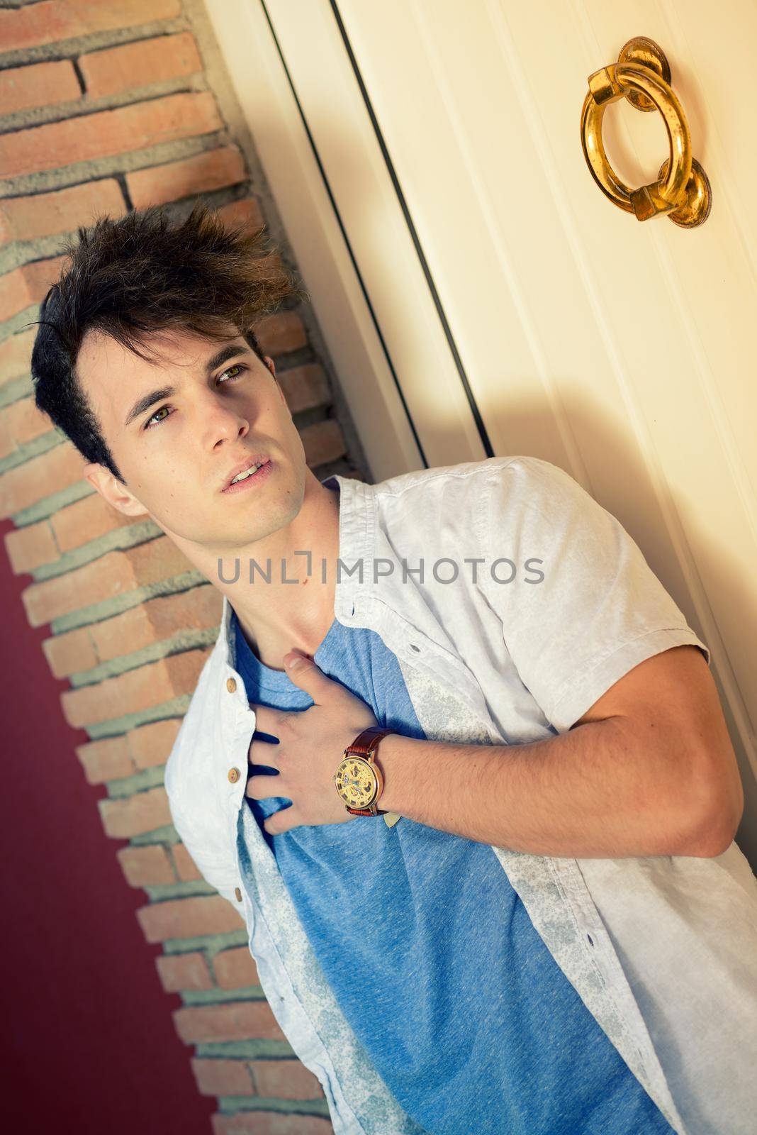 Portrait of attractive young man with a nice watch