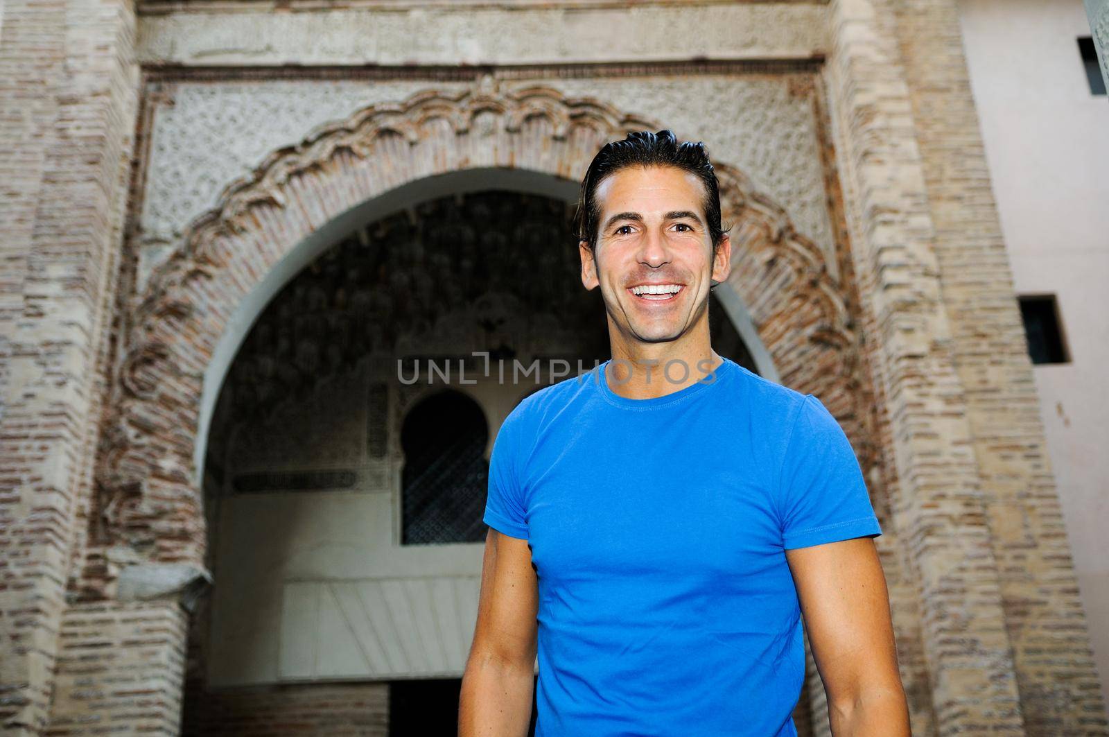 Portrait of an attractive smiling man in urban background