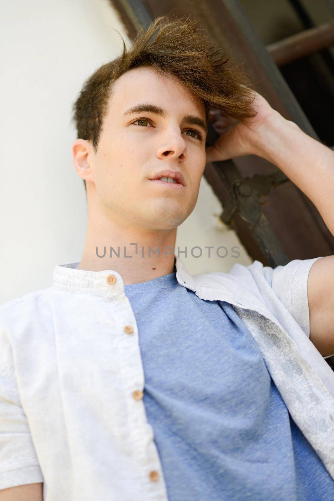 Portrait of attractive young man in urban background