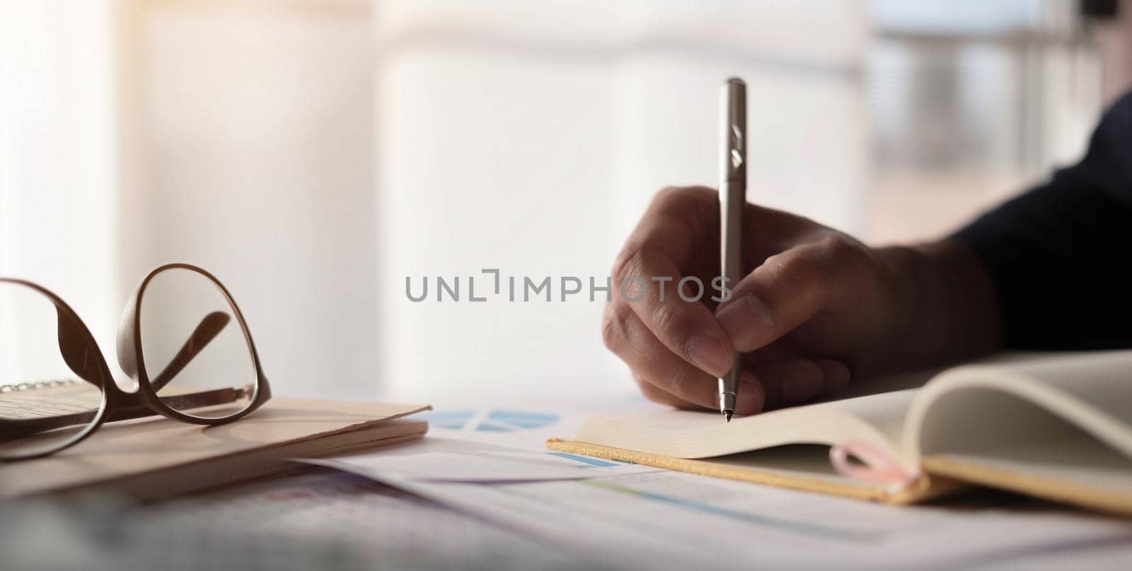 Closeup banner asian woman writing on notebook on table with laptop, girl work at coffee shop, freelance business concept..