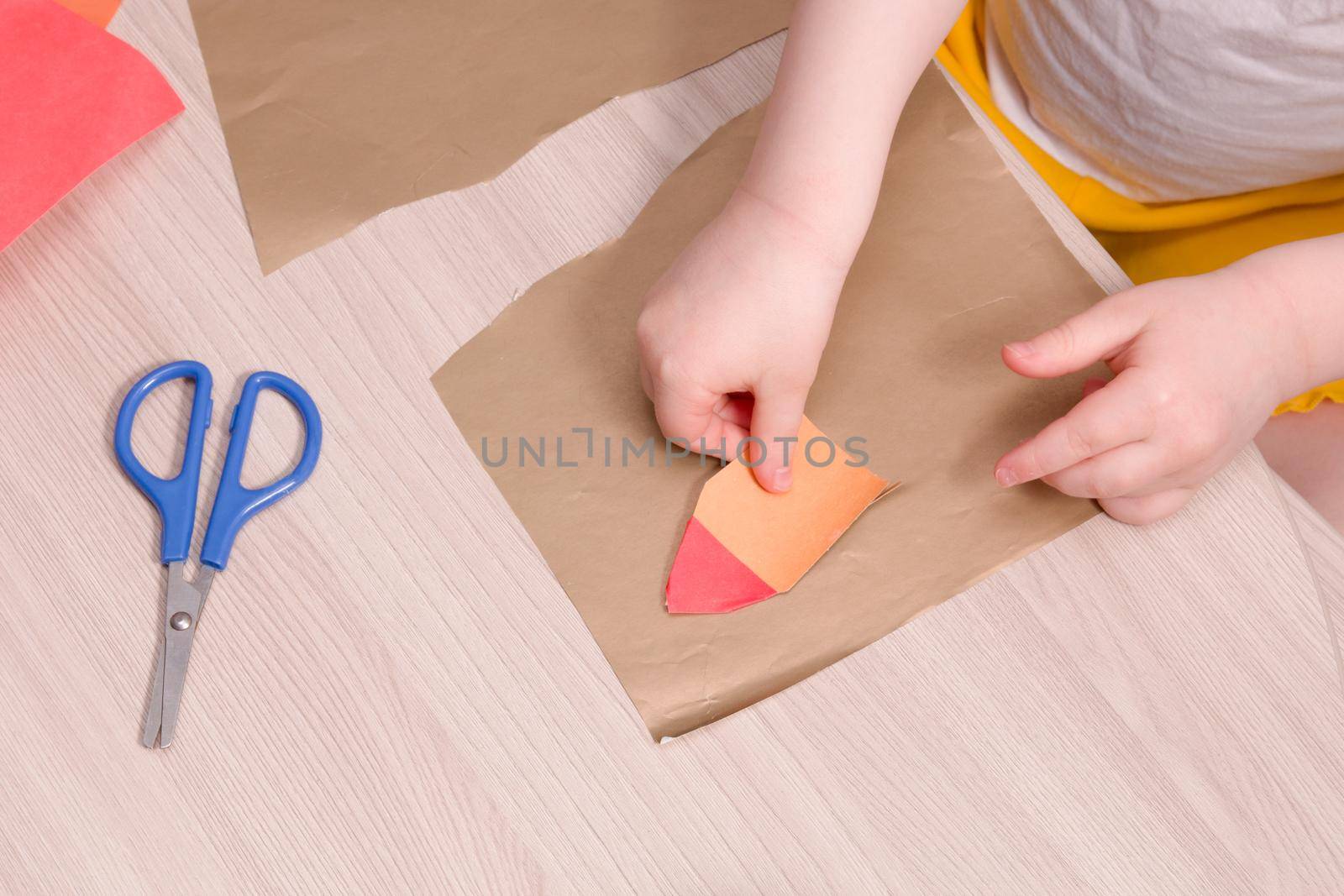 the child makes an applique, crafts from colored paper and toilet paper stools, what to do with the child at home, development of imagination and fine motor skills of hands by natashko