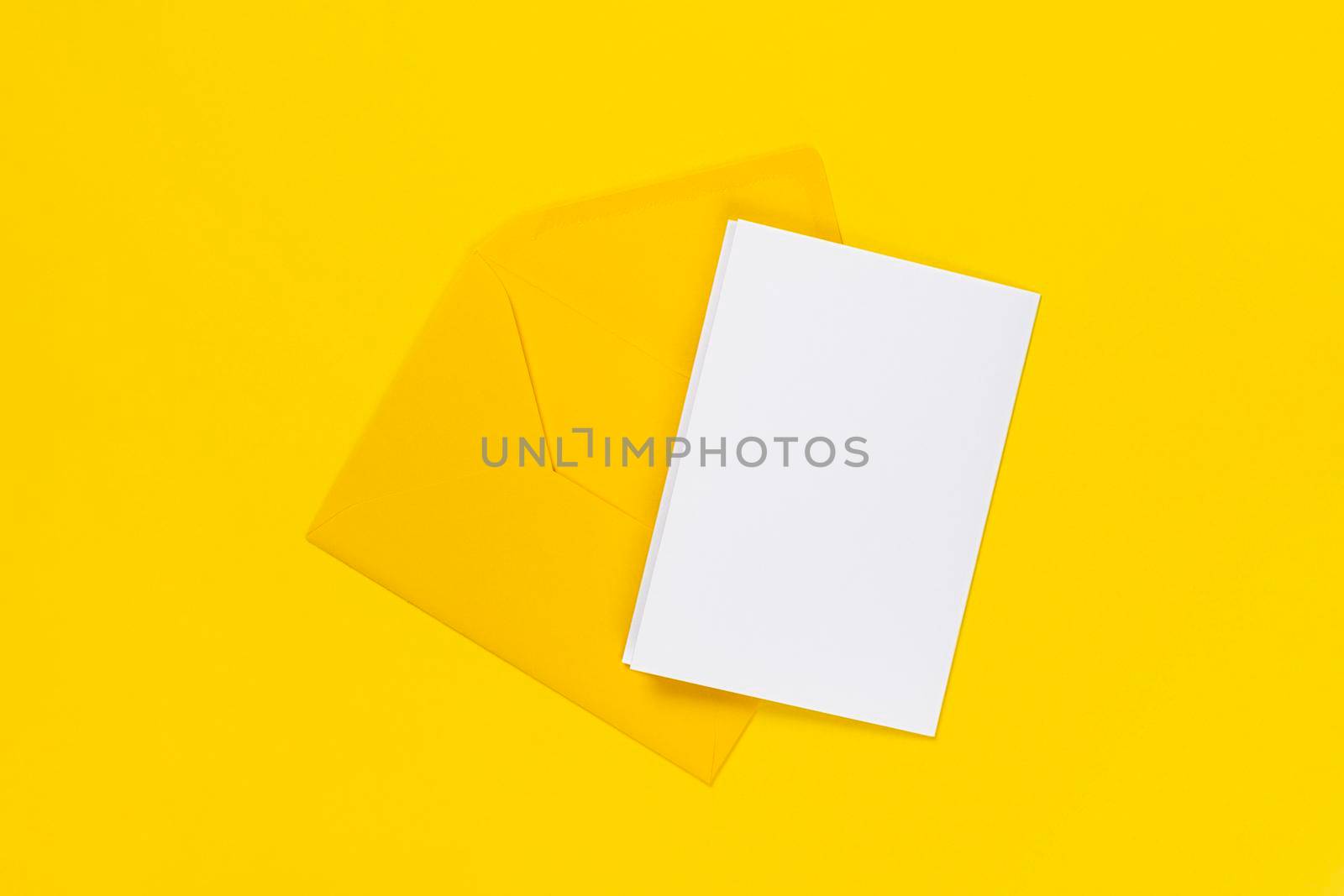 Blank white card with yellow envelope isolated on yellow background. Template or mock up. Banner with copy space.
