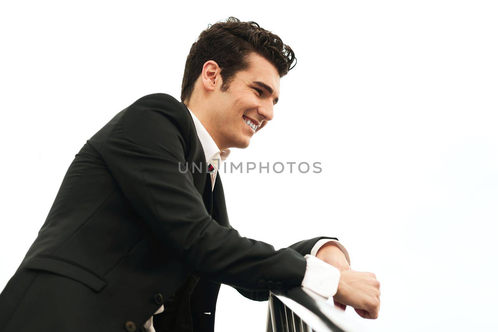 Portrait of a young businessman in urban background