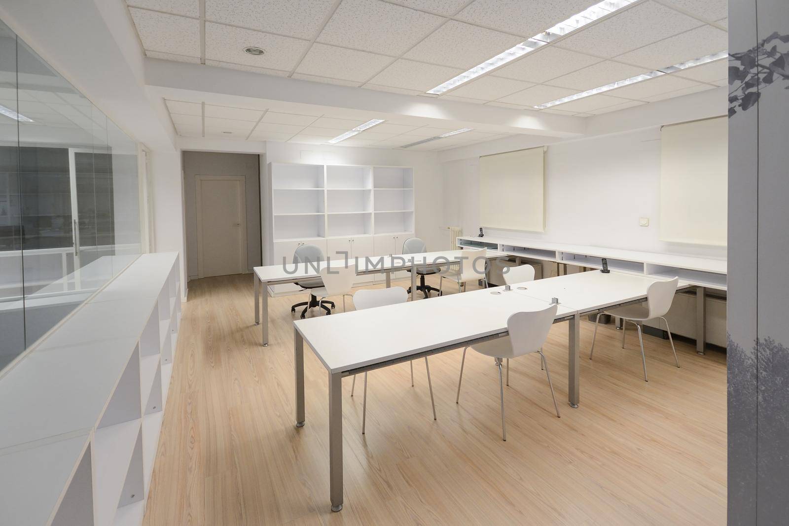 Empty modern office with white furniture