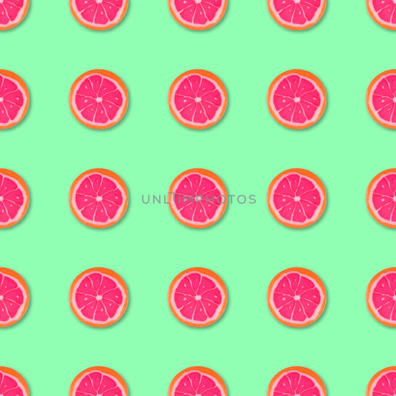 Lollipop candy seamless pattern on green background. Food background. Top view. Colorful candy seamless pattern