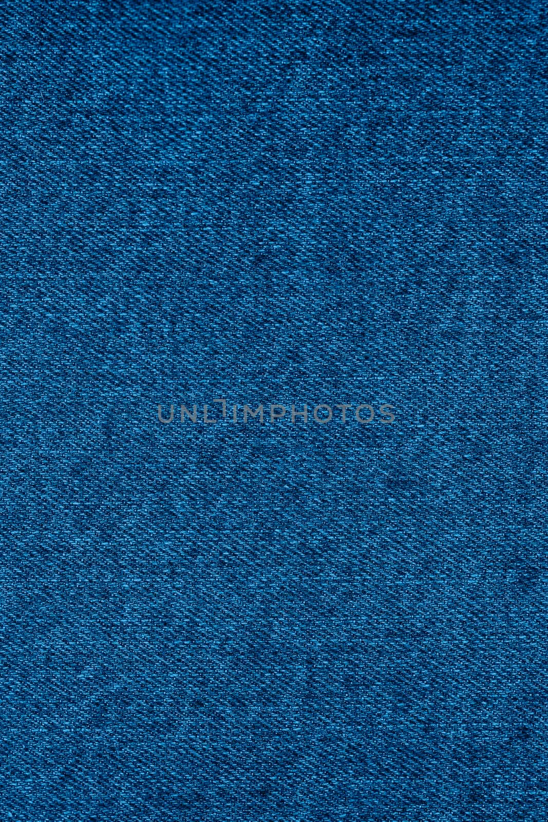 Blue jeans background close up. Top View. Blank Jeans Backdrop or Banner. Empty Simple Cloth Design. Trendy Banner with color of the year 2020. Long vertical banner.