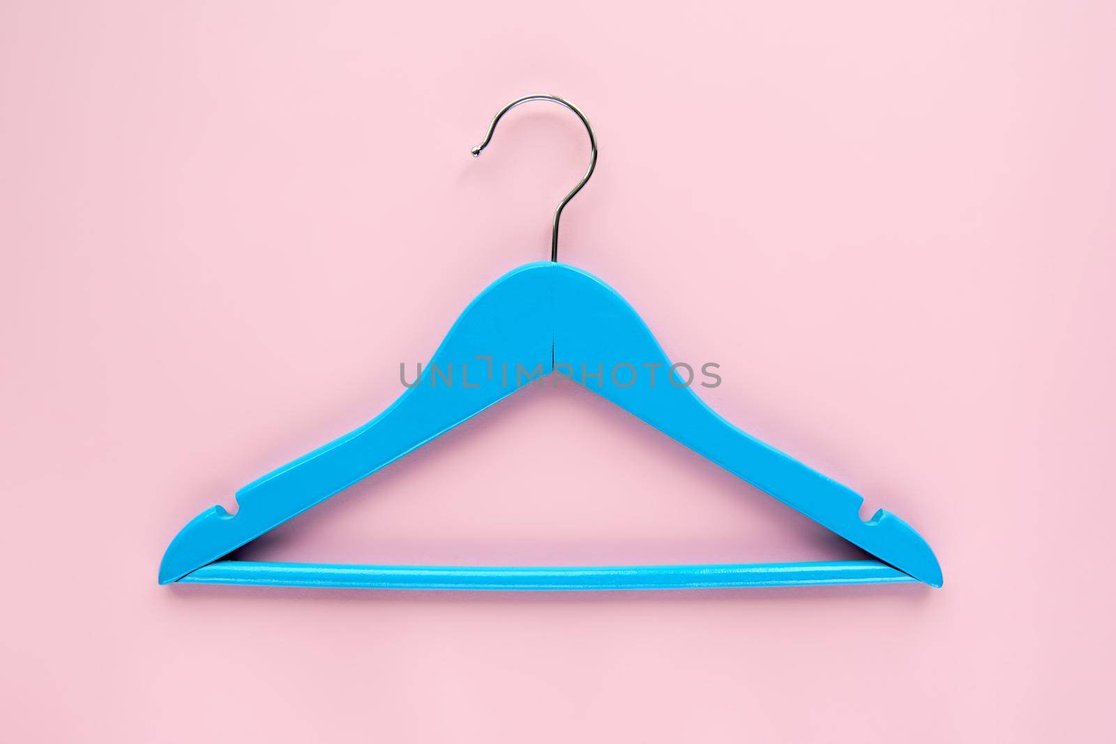 Wooden blue hanger with black paper label isolated on pink paper background. Clothing tag, label blank mockup template, to place your design. Black friday final sale banner by OneWellStyudio
