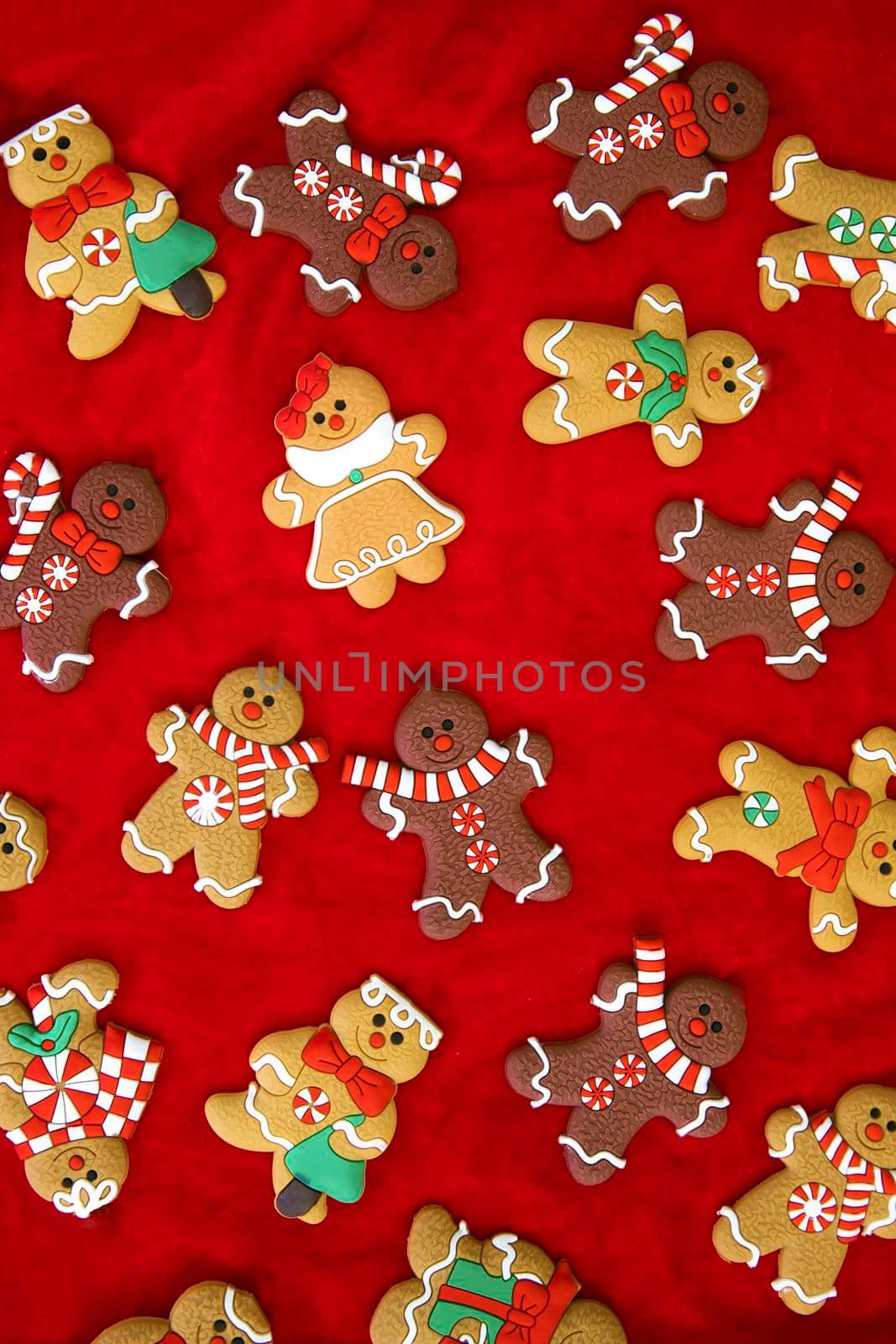 Christmas food. Gingerbread man cookies in Christmas setting. Xmas red background top view retro modern design various