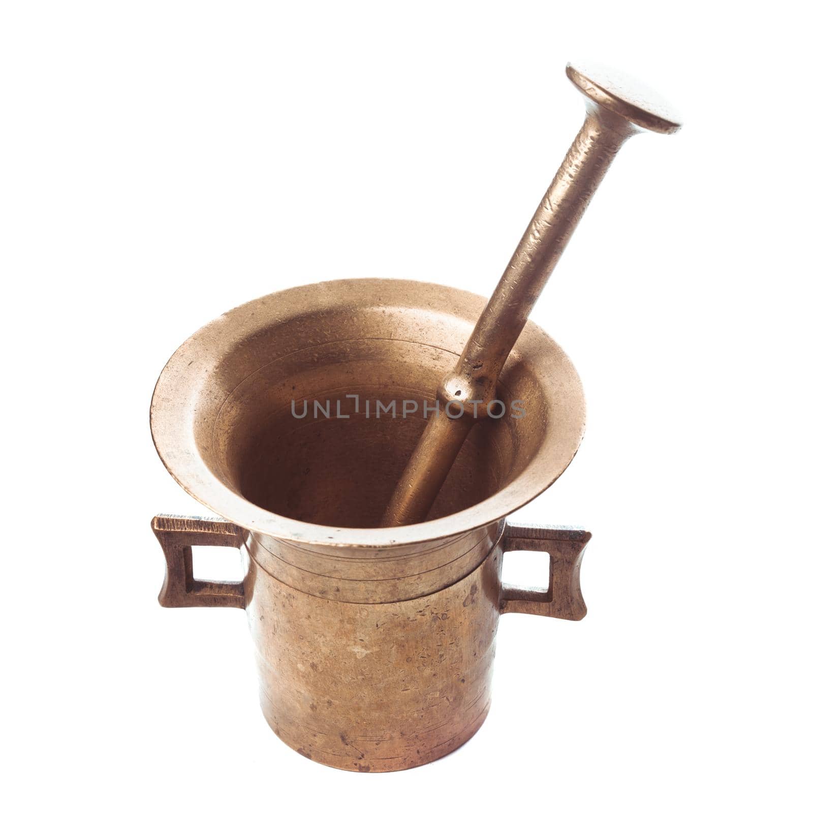 Retro copper mortar and pestle isolated on white