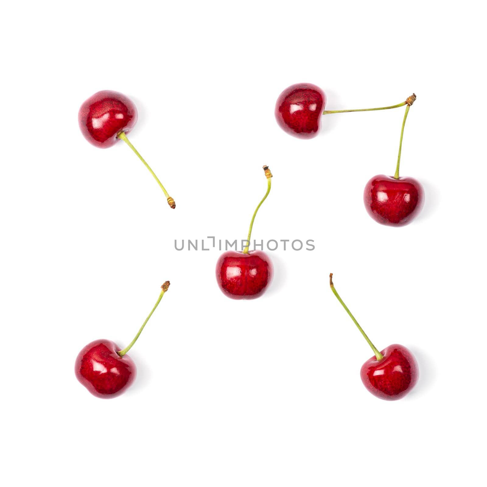 Ripe red sweet cherry isolated on white background. Macro photo close up. Six cherries on white background.