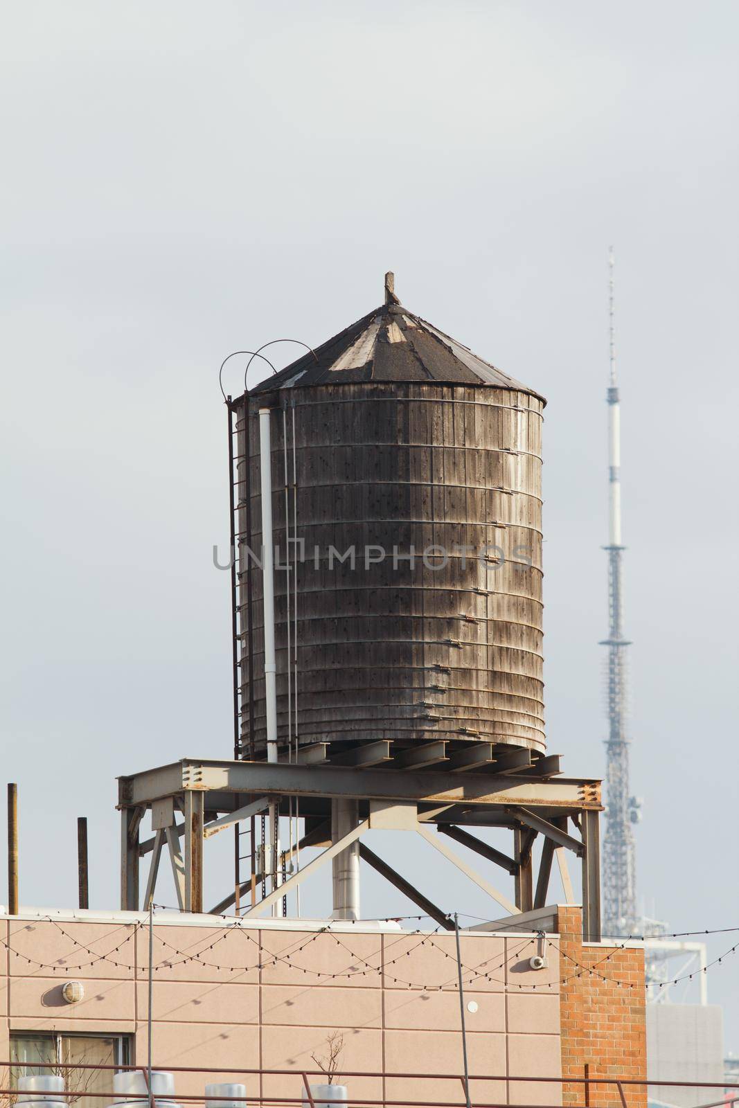 Fire barrel with water on the roof, New York, telephoto shot