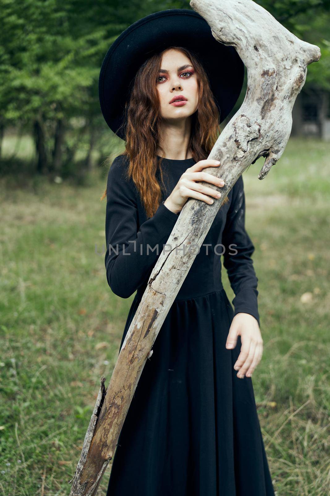 woman in witch costume fantasy magic forest posing by Vichizh