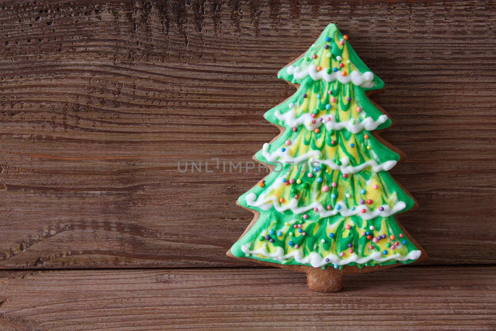 Christmas gingerbread on a brown wooden background