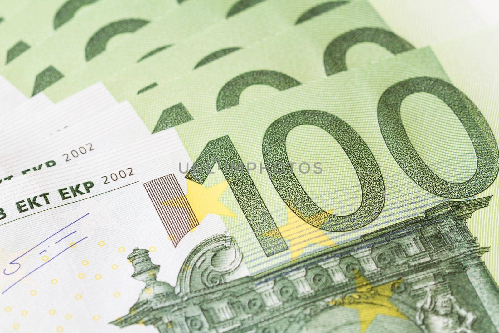 One hundred Euro (100) banknote in a macro shot. Selective focus